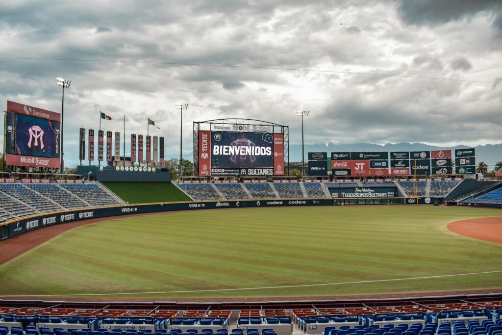 Empty baseball stadium in Monterrey, Mexico with electronic welcome sign.